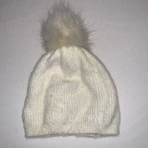 White beanie super soft with white puff ball on top. Great condition